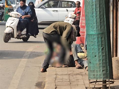 The life of a young man sleeping on the sidewalk is in danger.