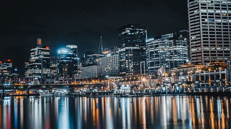 Download wallpaper 2560x1440 night city, buildings, lights, reflection ...