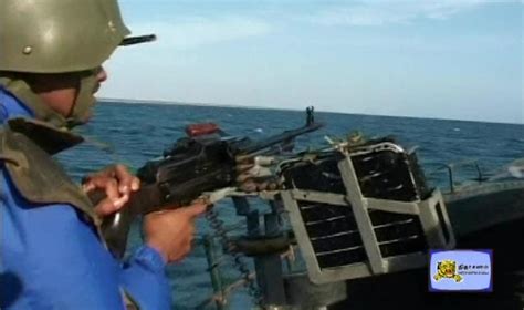 A Sea Tiger with a naval Work uniform of Tamileelam Navy holding a side ...