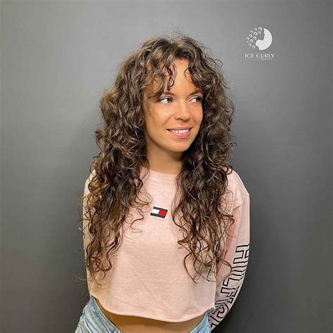 21 Best Ways To Get Curtain Bangs For Curly Hair Right Now