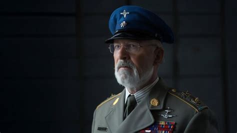 Old military officer standing in darkness | Premium AI-generated image