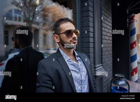 Man in a Business Suit in a Mall Parking Lot 的图像结果