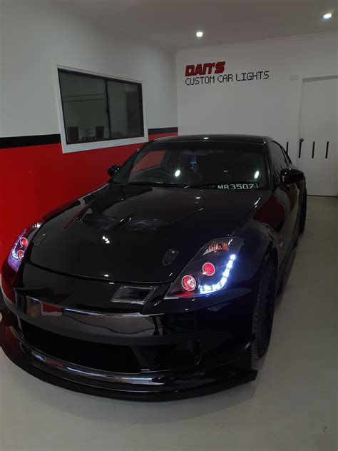 Nissan 350Z Headlights with Multicoloured Halo Rings, Demon Eyes and "Honeycomb" Projector Lens ...
