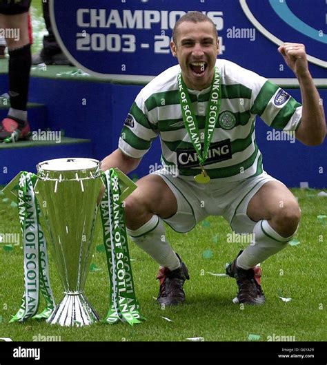 Celtic's Henrik Larsson celebrates winning the league championship ...