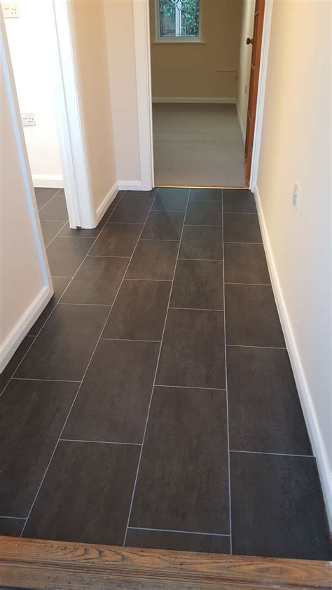 Slate tile vinyl flooring fitted in one piece to Hallway and kitchen ...