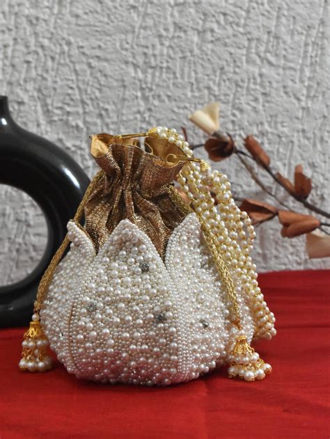 White Pearl Diamond Studded Lotus Potli | ClutchesandMore – Clutches ...