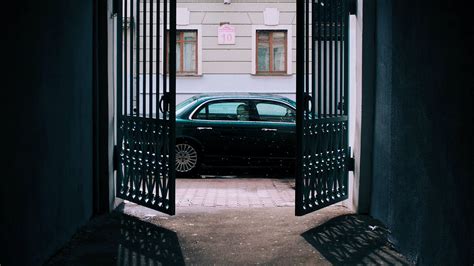 Wallpaper car, black, gate, building, street hd, picture, image