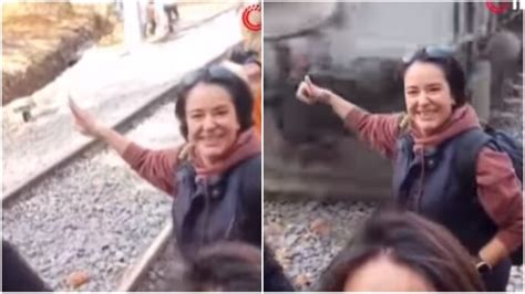 Woman almost loses arm while posing for selfie in front of moving train ...