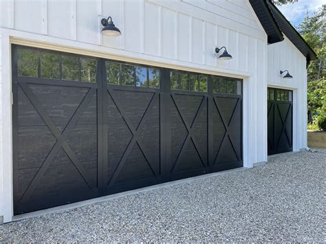 Modern Farmhouse with Black Garage Doors