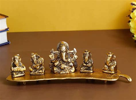 Buy SOLINO Metal Brass Musical Instrumental Lord Ganesh on Banana Leaf ...