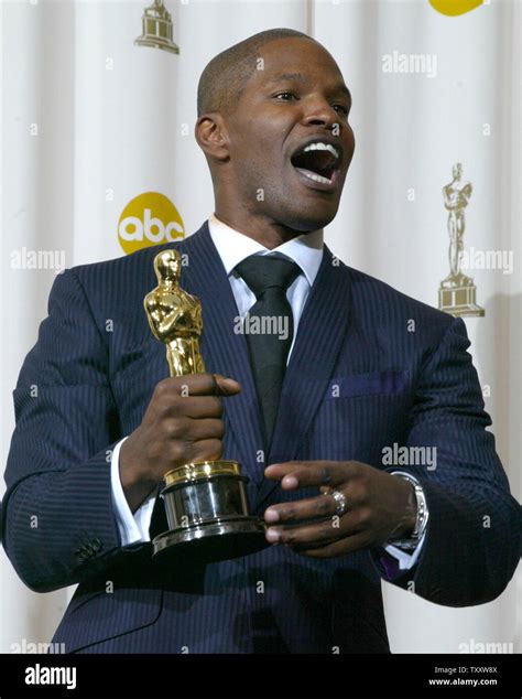 Jamie Foxx celebrates his best actor Oscar for his role in "Ray" at the 77th Academy Awards in ...