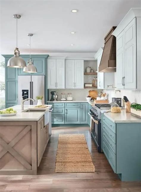 https://i.shelterness.com/2021/01/a-two-tone-L-shaped-kitchen-in-turquoise-and-light-blue-with-a-wooden-kitchen-island-and-pendant-lamps.jpg
