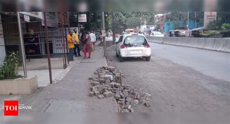 Leftover construction materials dumped on road - Times of India