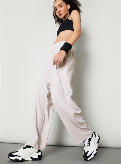 Buy Women Solid Wide Leg Trousers Online at just Rs. 1299.0 ...