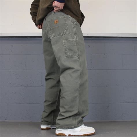 Carhartt carpenter pants Loose carpenters with... - Depop