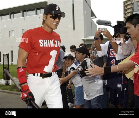 SAPPORO, Japan - Nippon Ham Fighters outfielder Tsuyoshi Shinjo arrive ...