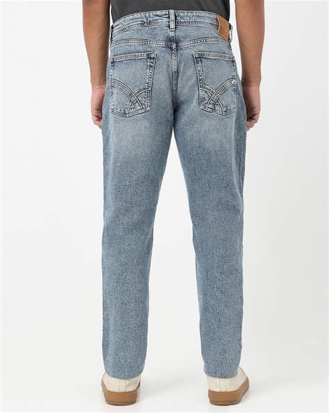 Nico Tapered Fit Mid Rise Mid Wash Blue Jeans