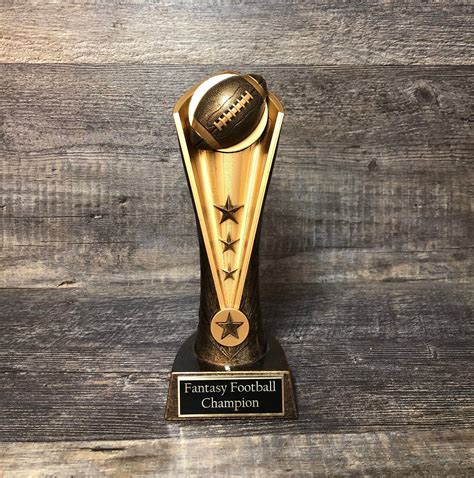 "This is a football trophy with a rustic antique gold look. It stands 9 ...