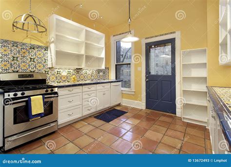 Kitchen with Terra Cotta Floor Tile Stock Image - Image of meal ...