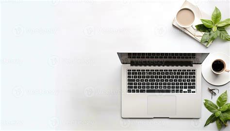 Laptop computer with coffee cup and plant on white background, top view ...