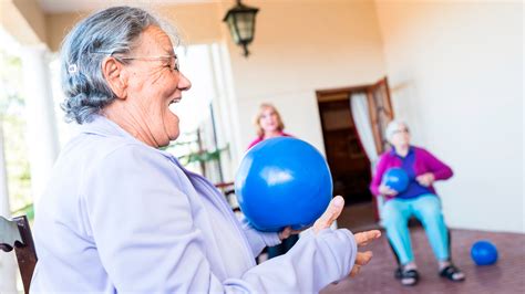 Build strength and improve balance with just a chair and a Pilates ball ...