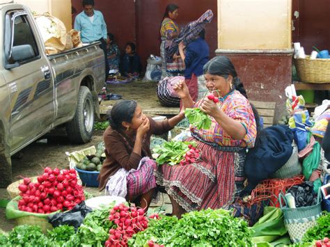 Guatemalan market; I love the interaction between mother and daughter ...