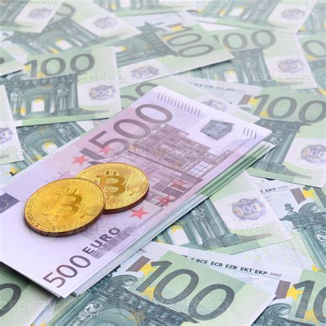 Golden physical bitcoins is lies on a set of green monetary ...