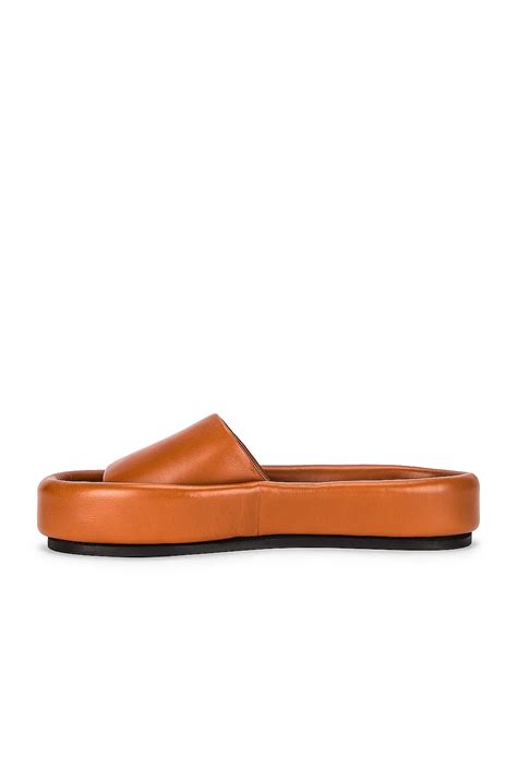 KHAITE Venice Pool Slides in Caramel | FWRD