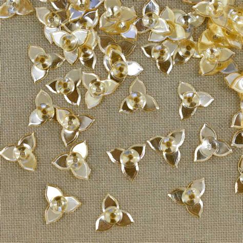 Buy Yellow color small flower shape sequins online at wholesale prices ...