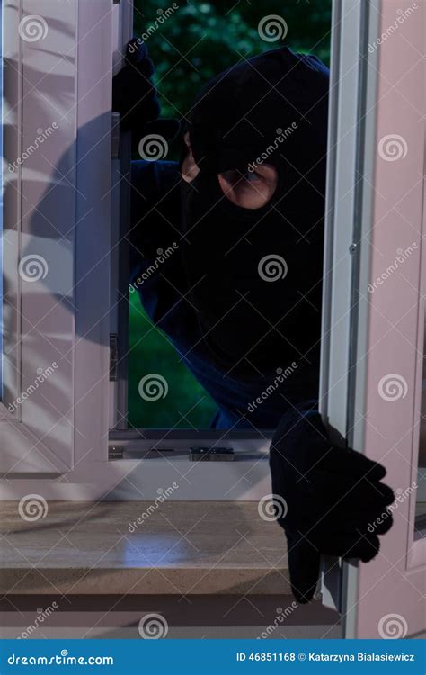Burglar opening the window stock photo. Image of danger - 46851168
