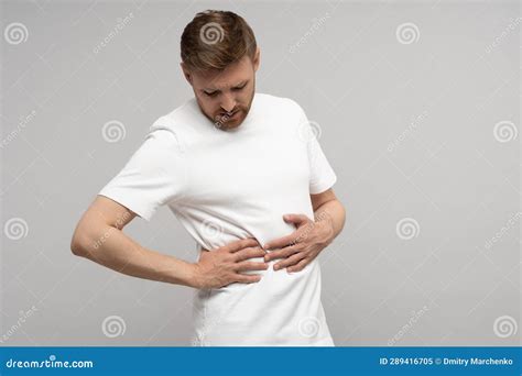 Pain in Right Side. Man Suffer from Sick Discomfort Under Ribs Feel Sharp Ache Studio Wall Stock ...