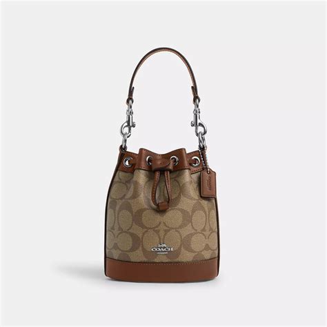 COACH Mini Bucket Bag In Signature Canvas in Brown | Lyst