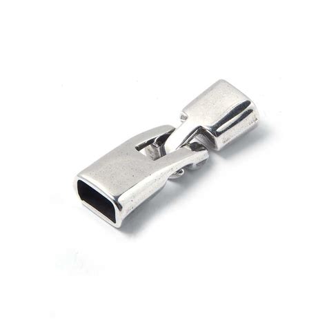 Cierre de arpón irregular, con huecos de 9.5mm x 5.5 mm. Bañado en ...