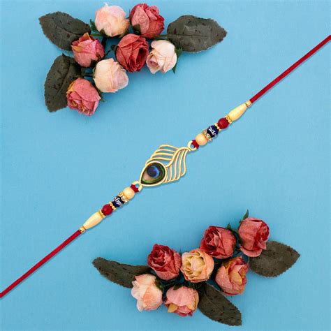 Peacock Feather Design Rakhi With Beaded Detailing And Red Thread ...