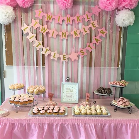 The centre of the party room: a pink and gold themed sweet table and ...