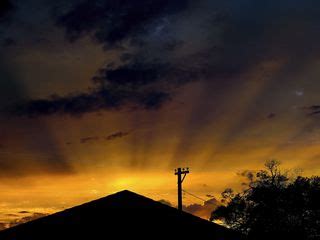 Download wallpaper 320x240 roof, pillar, silhouettes, sunset, dark ...