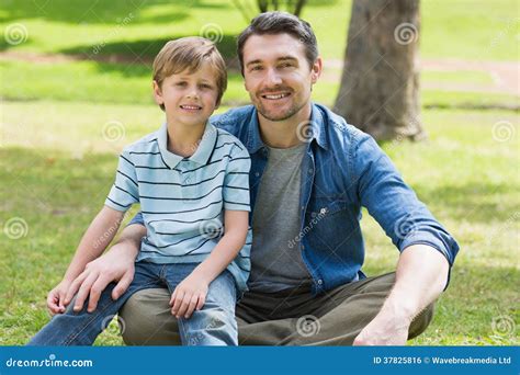 Portrait of a Father and Boy at Park Stock Photo - Image of smiling ...