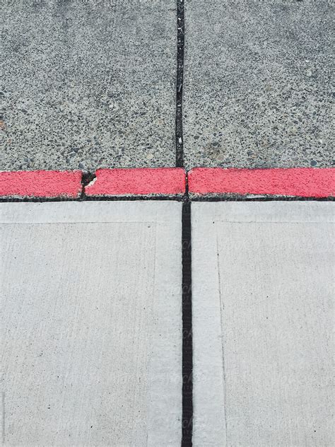 "Painted Red Curb Along Urban Sidewalk And Street" by Stocksy ...