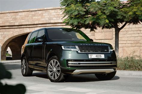 Rent Land Rover Range Rover HSE Green in Dubai - SUV - Octane.Rent