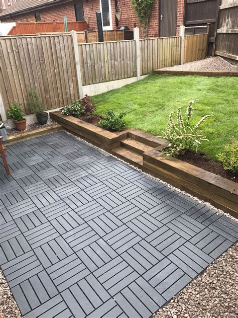 Ikea runnen decking tiles used to create a new garden | Patio flooring ...