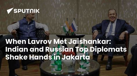 Indian & Russian Top Diplomats Shake Hands in Jakarta