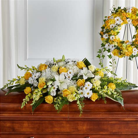 Golden Harmony Casket Spray–Vern's Sharonville Florist