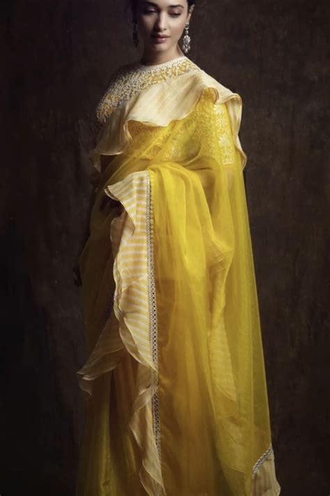 Tamannaah Bhatia glows in a bright yellow ruffle saree | Vogue India