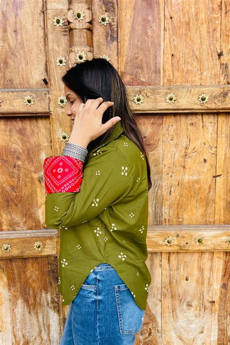 “Woman wearing the Bandhani shirt in olive with red bandhani patch ...