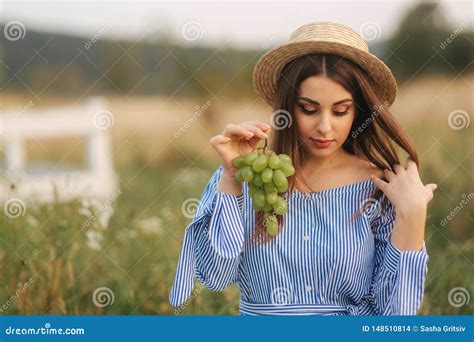 Beautiful Pregnant Woman Show and Eat Green Grapes. Healthy Food. Fresh Fruits. Happy Woman ...