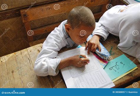 A Boy Studying and Writing Homework in Arabic Editorial Photography ...