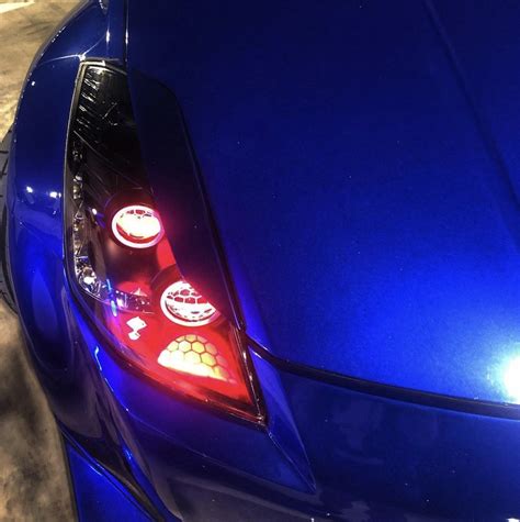 Nissan 350Z Headlights with Multicoloured Halo Rings, Demon Eyes and "Honeycomb" Projector Lens ...