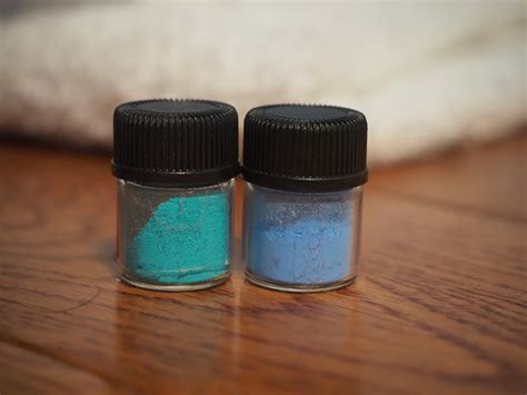 Anhydrous copper citrate on the right and hydrated copper citrate on ...