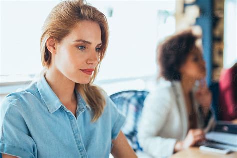 Businesswoman Sitting in Office Stock 的图像结果