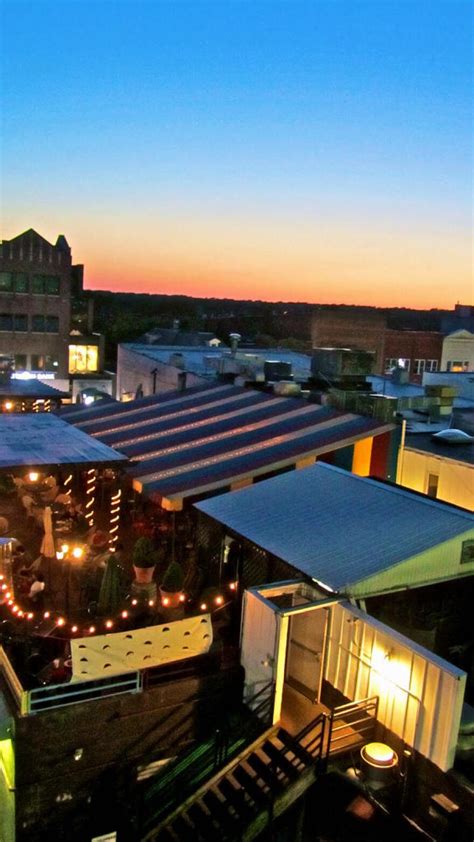 Outdoor dining area with colorful striped awning and string lights, showcasing a vibrant atmosphere for managed IT services events in Pennsylvania.